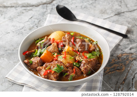 Semur Daging or Sweet Beef Stew closeup in the bowl. Horizontal 128792014