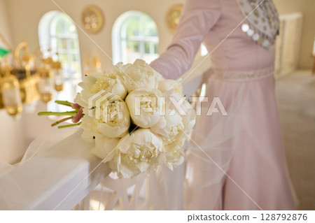 An Elegant Hand Resting on a White Bannister Adorned with Beautiful Delicate Fabric An Elegant Hand Resting on a White Bannister Adorned with Beautiful Delicate Fabric 128792876