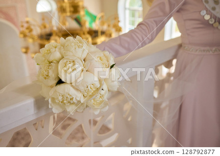An Elegant Hand Resting on a White Bannister Adorned with Beautiful Delicate Fabric An Elegant Hand Resting on a White Bannister Adorned with Beautiful Delicate Fabric 128792877