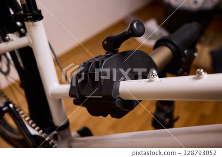 Utilizing a Bike Maintenance Setup Complete with a Repair Stand, Essential Tools, and More 128793052
