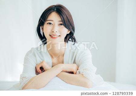 A woman relaxing in the bedroom 128793339