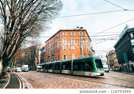 Winter in Milan: A street corner with a tram running Winter in Milan: A street corner with a tram running 128793944