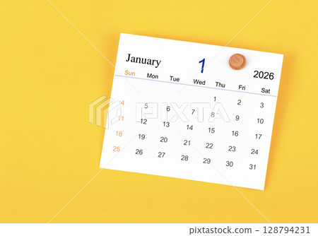 January 2026 card calendar and wooden push pin on yellow color wall. 128794231