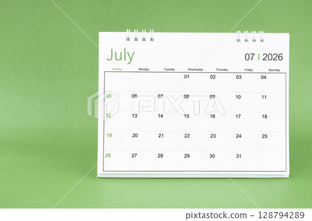 July 2026 desk calendar in green color background. 128794289