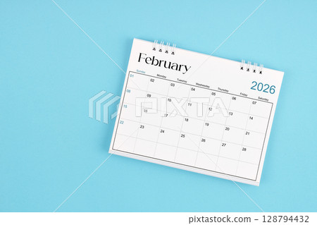 February 2026 Monthly desk calendar for 2026 year on blue color background. 128794432