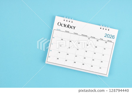October 2026 Monthly desk calendar for 2026 year on blue color background. 128794440