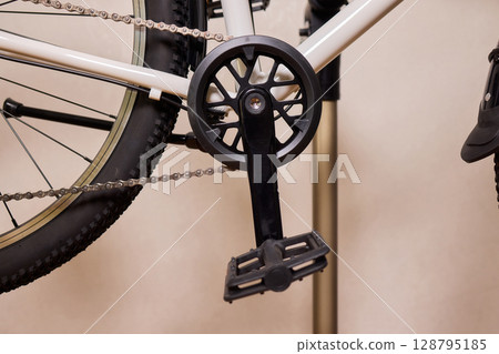 Close Up of a Bicycle Gear and Chain Highlighting Their Design and Functionality 128795185