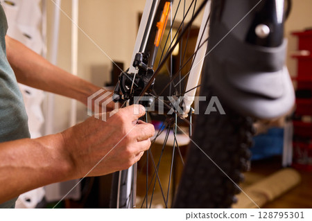 Close Up of a Bicycle Gear and Chain Highlighting Their Design and Functionality 128795301