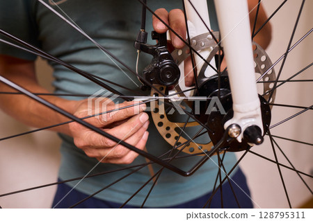 Close Up of a Bicycle Gear and Chain Highlighting Their Design and Functionality 128795311
