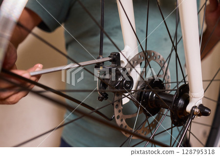 Close Up of a Bicycle Gear and Chain Highlighting Their Design and Functionality Close Up of a Bicycle Gear and Chain Highlighting Their Design and Functionality 128795318