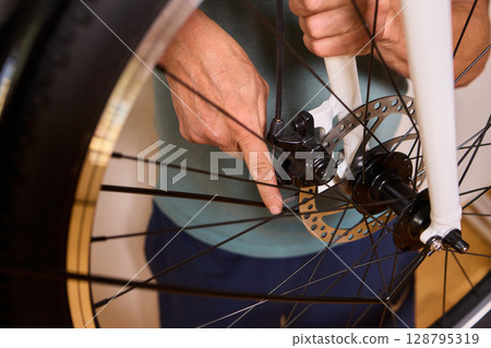 Close Up of a Bicycle Gear and Chain Highlighting Their Design and Functionality 128795319