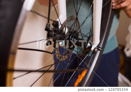 Close Up of a Bicycle Gear and Chain Highlighting Their Design and Functionality Close Up of a Bicycle Gear and Chain Highlighting Their Design and Functionality 128795334