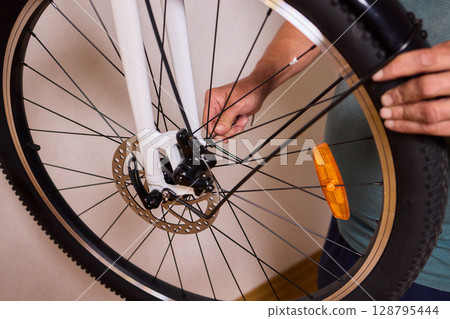 Close Up of a Bicycle Gear and Chain Highlighting Their Design and Functionality Close Up of a Bicycle Gear and Chain Highlighting Their Design and Functionality 128795444