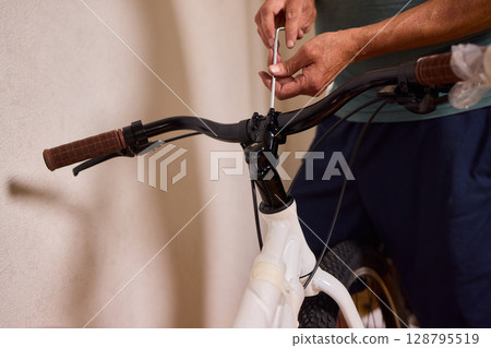 Bike Assembly in Progress Here is a Close Up View of The Entire Process Taking Place 128795519