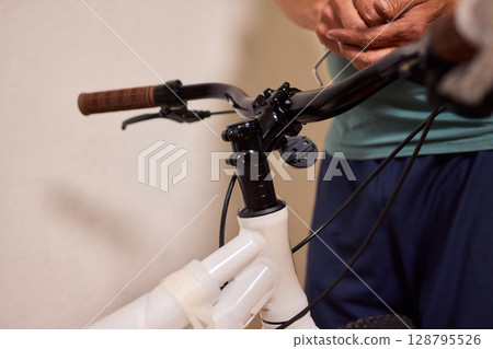 Bike Assembly in Progress Here is a Close Up View of The Entire Process Taking Place 128795526