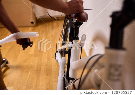 Bike Assembly in Progress Here is a Close Up View of The Entire Process Taking Place Bike Assembly in Progress Here is a Close Up View of The Entire Process Taking Place 128795537
