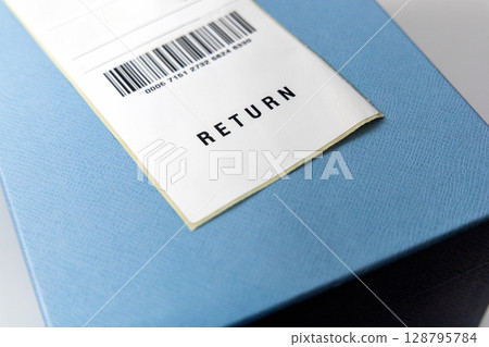 Return shipping label on the blue box. Close-up Return shipping label on the blue box. Close-up 128795784