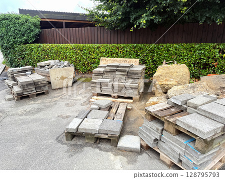 Replacement of paving slabs on the road Replacement of paving slabs on the road 128795793