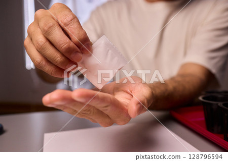 Hands Skillfully Managing Hydroponic Growing Medium with Exact Precise Careful Techniques 128796594