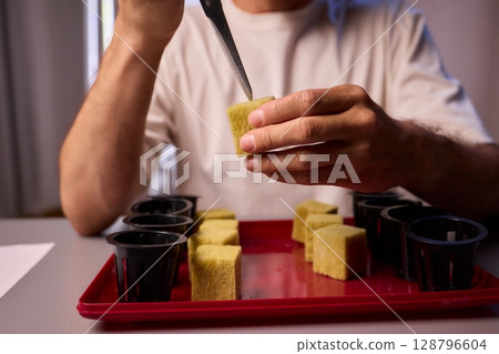 Hands Skillfully Managing Hydroponic Growing Medium with Exact Precise Careful Techniques 128796604