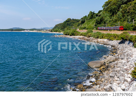A 103 series DC train running on the coastal JR Chikuhi Line 128797602