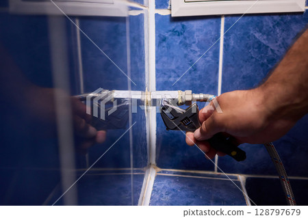 Essential Plumbing Maintenance Performing Necessary Adjustments to Water Valves and More Essential Plumbing Maintenance Performing Necessary Adjustments to Water Valves and More 128797679