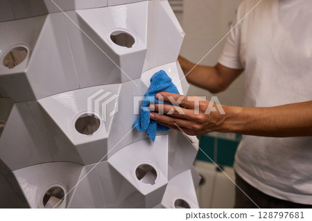 Engaging in a Cleaning Activity within a Contemporary Bathroom Environment Setting Engaging in a Cleaning Activity within a Contemporary Bathroom Environment Setting 128797681