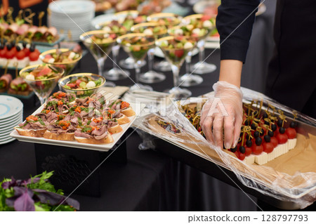 An Elegant Assortment of Gourmet Desserts and Savory Snacks Beautifully Arranged on Table 128797793