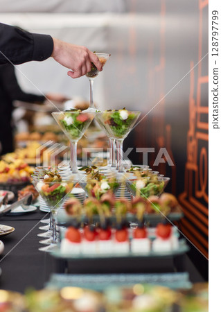 An Elegant Assortment of Gourmet Desserts and Savory Snacks Beautifully Arranged on Table An Elegant Assortment of Gourmet Desserts and Savory Snacks Beautifully Arranged on Table 128797799