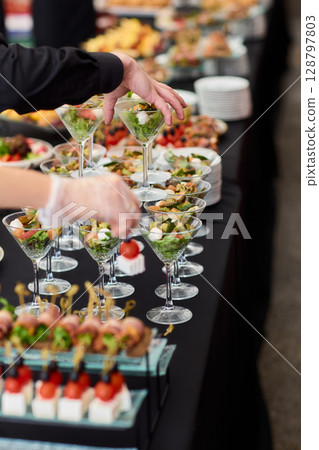 An Elegant Assortment of Gourmet Desserts and Savory Snacks Beautifully Arranged on Table An Elegant Assortment of Gourmet Desserts and Savory Snacks Beautifully Arranged on Table 128797803