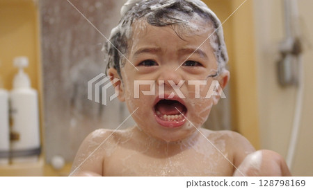Year-old boy cries after shampoo gets in his eyes Year-old boy cries after shampoo gets in his eyes 128798169