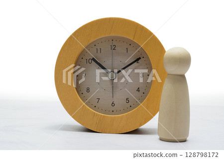 Clock and little doll 128798172