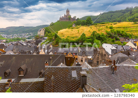 Reichsburg Cochem above rooftops in Cochem Germany 128798340