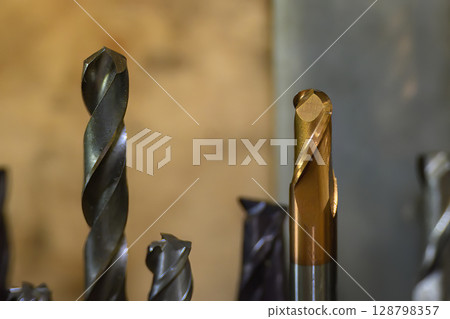 Close-up scene the used coating solid ball nose end mill tools. Close-up scene the used coating solid ball nose end mill tools. 128798357