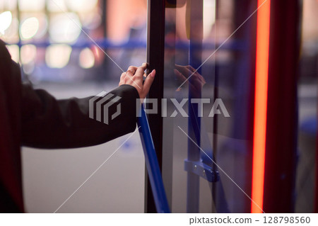 The Night Bus Ride An Experience of Waiting to Depart Under Vibrant Neon Lights at Dusk The Night Bus Ride An Experience of Waiting to Depart Under Vibrant Neon Lights at Dusk 128798560
