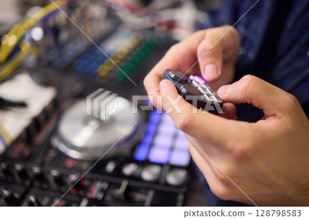 DJ Equipment Featuring a Vibrant and Colorful Controller Perfect for Mix and Beat Creation DJ Equipment Featuring a Vibrant and Colorful Controller Perfect for Mix and Beat Creation 128798583