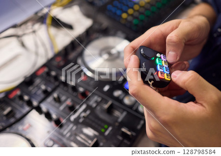 DJ Equipment Featuring a Vibrant and Colorful Controller Perfect for Mix and Beat Creation DJ Equipment Featuring a Vibrant and Colorful Controller Perfect for Mix and Beat Creation 128798584