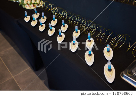 An Elegant Assortment of Gourmet Desserts and Savory Snacks Beautifully Arranged on Table An Elegant Assortment of Gourmet Desserts and Savory Snacks Beautifully Arranged on Table 128798663