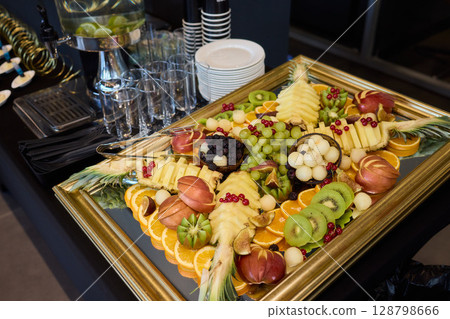 An Elegant and Colorful Fruit Platter Featuring a Variety of Exquisite Exotic Fruits 128798666