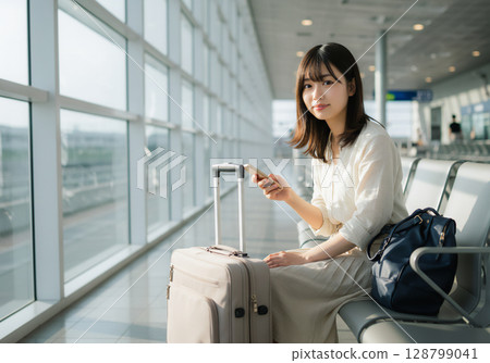 Portrait of a woman at the airport 128799041