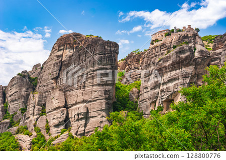 Historic Meteora monastery sitting atop sheer cliffs in northern Greece Historic Meteora monastery sitting atop sheer cliffs in northern Greece 128800776