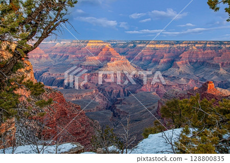 Wide Grand Canyon panorama with snowy rim 128800835