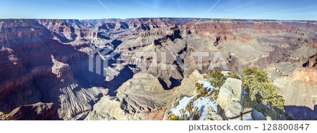 Wide Grand Canyon panorama with snowy rim 128800847