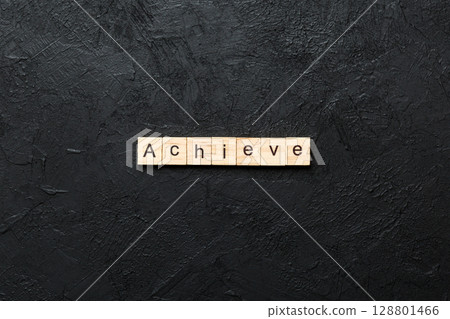 Achieve word written on wood block. Achieve text on cement table for your desing, concept 128801466