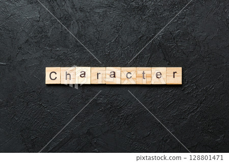 CHARACTER word written on wood block. CHARACTER text on cement table for your desing, concept CHARACTER word written on wood block. CHARACTER text on cement table for your desing, concept 128801471