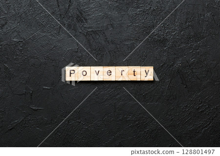 Poverty word written on wood block. Poverty text on cement table for your desing, concept Poverty word written on wood block. Poverty text on cement table for your desing, concept 128801497