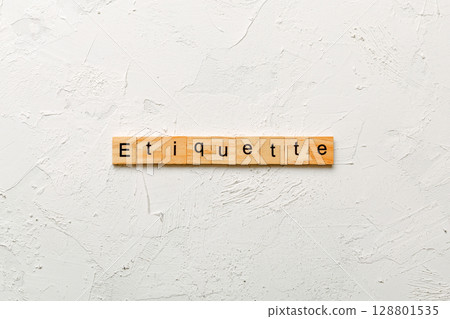 ETIQUETTE word written on wood block. ETIQUETTE text on cement table for your desing, concept ETIQUETTE word written on wood block. ETIQUETTE text on cement table for your desing, concept 128801535