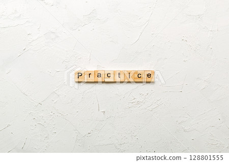 practice word written on wood block. practice text on table, concept practice word written on wood block. practice text on table, concept 128801555
