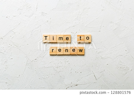 time to renew word written on wood block. time to renew text on table, concept time to renew word written on wood block. time to renew text on table, concept 128801576