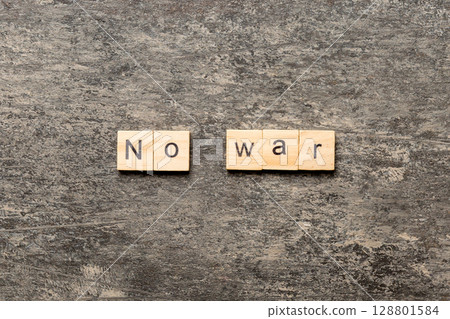 No war word written on wood block. No war text on table, concept No war word written on wood block. No war text on table, concept 128801584